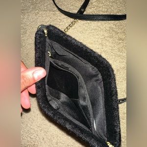 A very small crossbody purse! Very nice !!! I forgot where I got this from